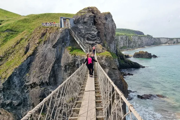 Visitors crossing Carrick-a-Rede Rope Bridge in County Antrim on the Carrick-a-Rede Rope Bridge