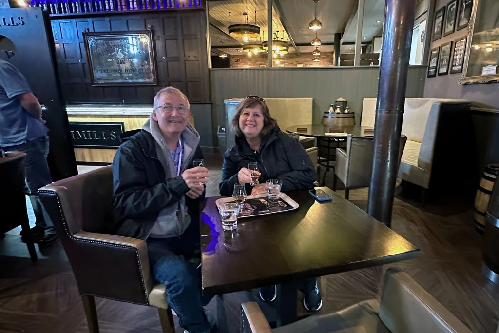 Visitors enjoying a whiskey tasting at Old Bushmills Distillery in County Antrim