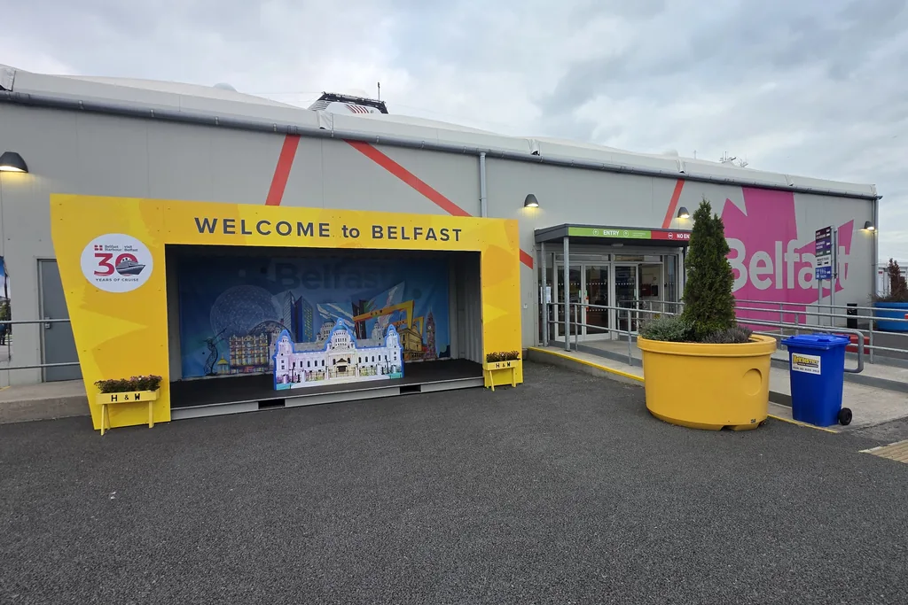 Welcome to Belfast archway beside the passenger doors at Belfast Cruise Terminal, where guides wait to meet arriving cruise guests