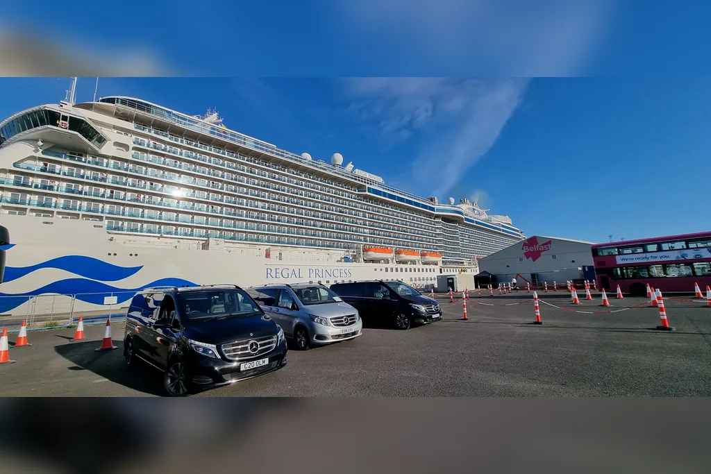 Three Belfast Tours NI Mercedes-Benz V-Class vehicles waiting beside the Regal Princess at Belfast Cruise Terminal