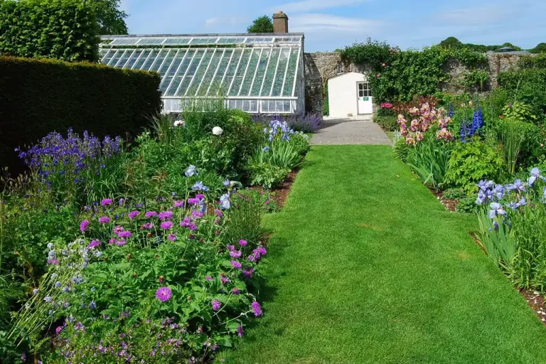 The herbaceous borders and glasshouse in the walled garden at Glenarm Castle